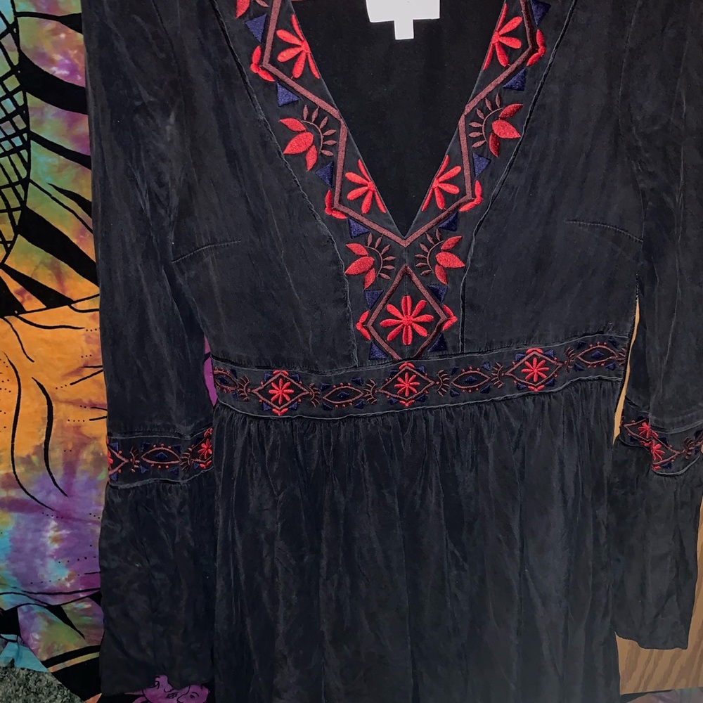 Long flare sleeved dress.